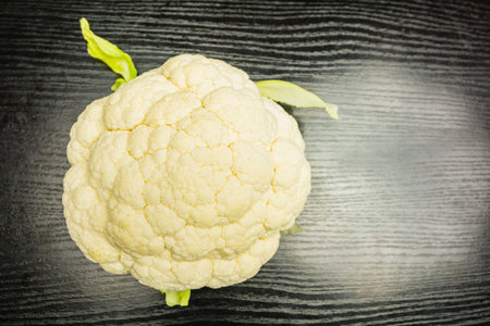 White fresh cauliflower on the table. View from above.の写真素材