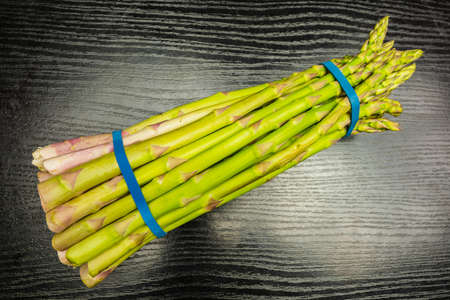 A bundle of cultivated green asparagus. View from above.の写真素材