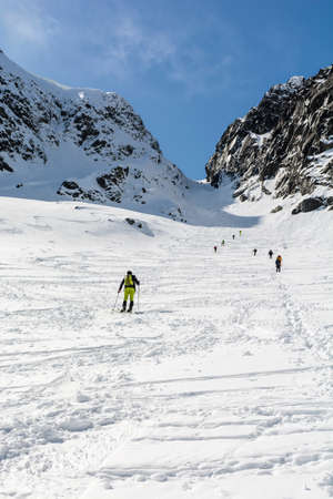 Zakopane, Poland - April 07, 2018: Spring ski touring and hiker approach on the mountain pass (Zawrat) in the Tatra Mountains.のeditorial素材