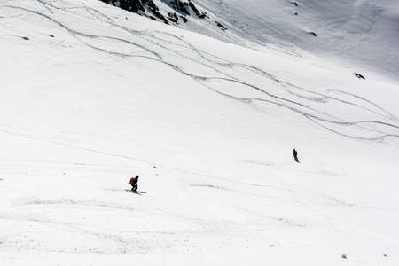 Zakopane, Poland - April 07, 2018: Freeriding. Skiers during a downhill ride in the mountains.のeditorial素材