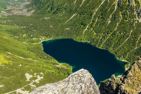 A beautiful view of the valley with the Sea Eye (Morskie Oko) lake from the peak of the Monk (Mnich) in the Polish Tatra Mountains.の写真素材