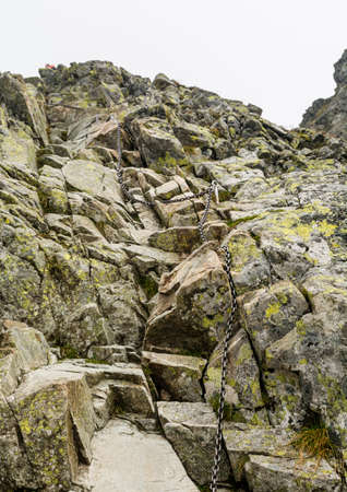 Chain on the harder section of the route to Rysy peak, Poland.の写真素材