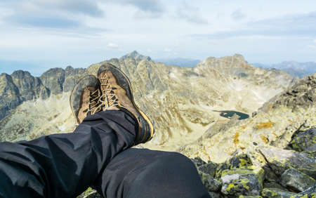 Leather shoes approach on the background of mountains.の写真素材