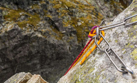Climbing rope postponed by mounted fixed rappel stance, prepared for descent from the top.の写真素材