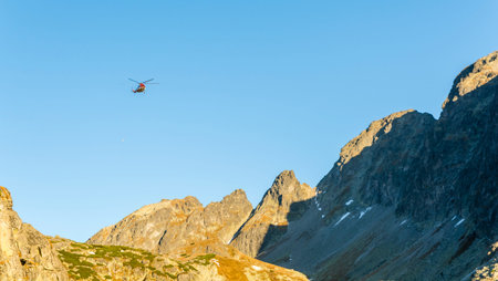 Stary Smokovec, Slovakia - October 12, 2018: The helicopter (Type Mil Mi-8T) returns after shelter deliveries to the mountains. Tatra Mountains.のeditorial素材