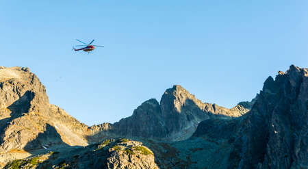 Stary Smokovec, Slovakia - October 12, 2018: The helicopter OM-Eva (Type Mil Mi-8T) returns after shelter deliveries to the mountains. Tatra Mountains.のeditorial素材