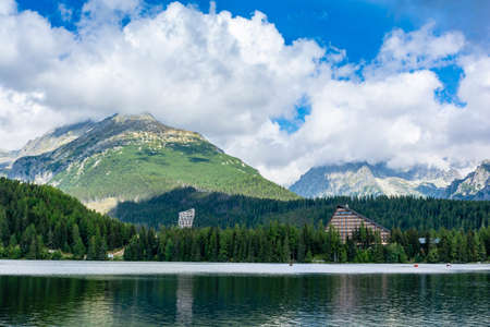 Strbske Pleso, Slovakia - September 11, 2020: Viewing tower and a characteristic hotel building by the lake Strbske pleso in the mountains of the High Tatras, Slovakia.のeditorial素材