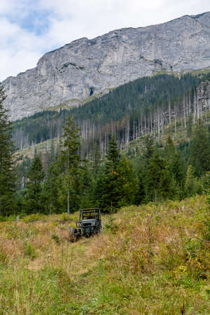 Tatranska Javorina, Slovakia - September 14, 2021: Off-road vehicle used for logging by lumberjacks in mountainous terrain.のeditorial素材