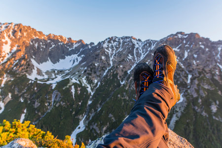 Stretch your legs up, that is, rest in the mountains at sunrise.の写真素材