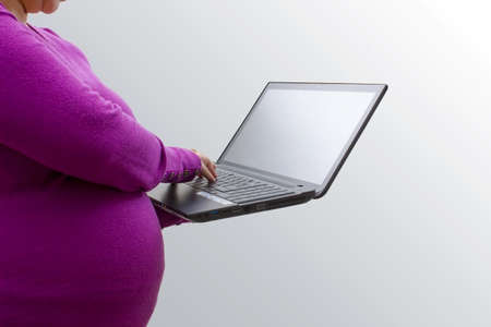 Pregnant woman working from homeの写真素材