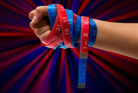 Measuring tape wrap arround handの写真素材