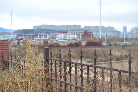City buildings beyond a gateの写真素材