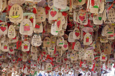 Hanging wooden plaques with wishesのeditorial素材