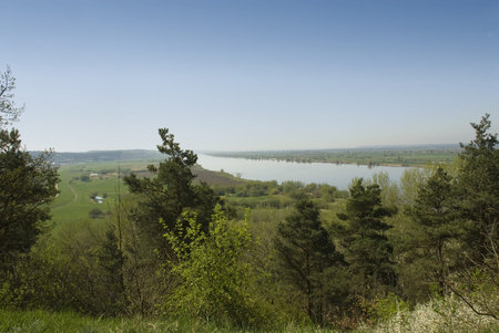 Spring panorama of river, meadows and the cityの写真素材
