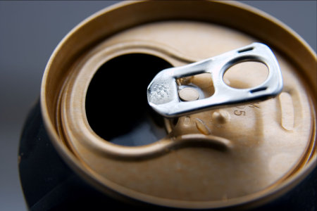 Closup of an open can of cold beer