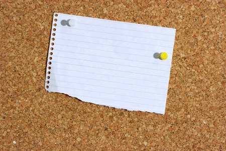 A piece of paper pinned to a board. You can add your own textの写真素材