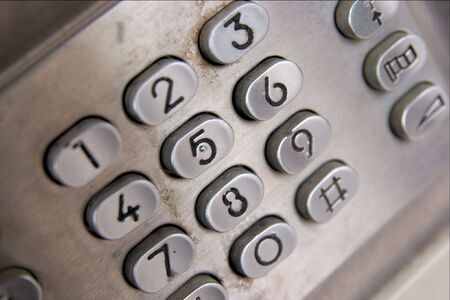 Closeup of the buttons of a public phoneの写真素材