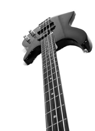 Black bass guitar on white fluffy draperyの写真素材