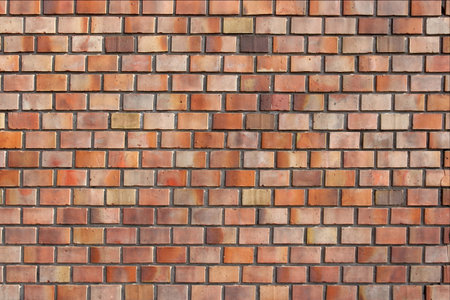 Simple brick wall with tiny reddish bricks