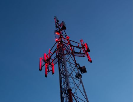 Transmitter station in the night glowing redの写真素材