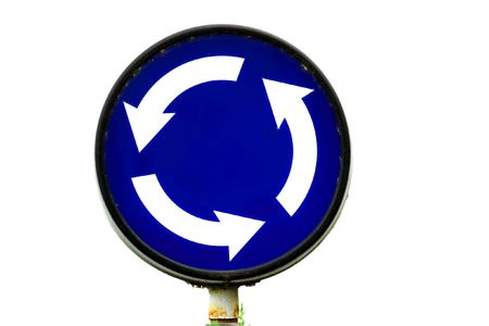 Roundabout traffic sign isolated on whiteの写真素材