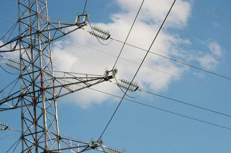 High voltage electric pillar against blue sky