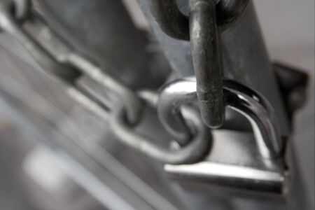 Metal gate locked with a padlock and a chainの写真素材