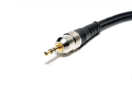 3.5mm gold plated jack plug isolated on white
