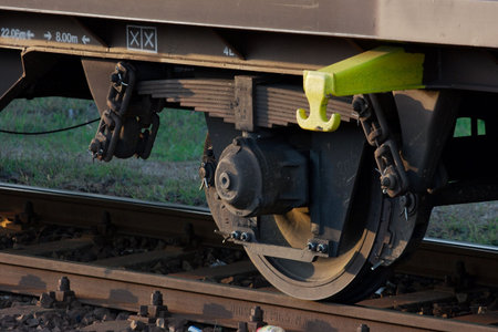 Closeup of the wheels of a railroad carriageの写真素材