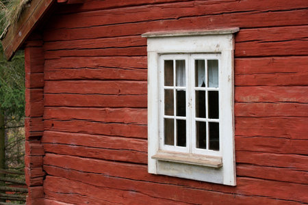 Part of a small red, wooden house in Scandinaviaの写真素材