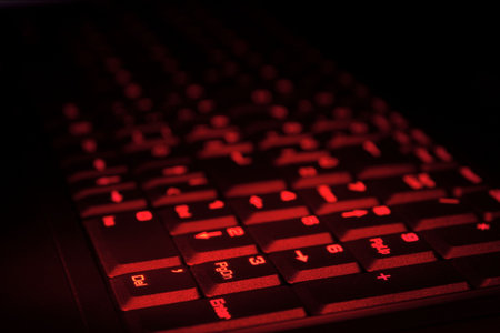 keyboard in the dark glowing in red