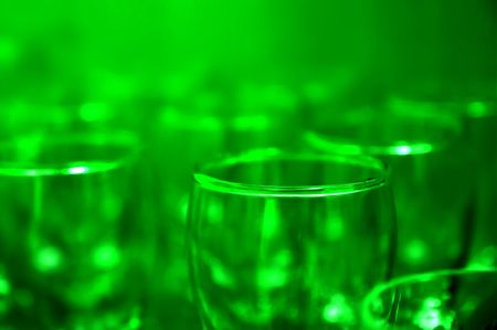 Simple glasses in green light (shallow DoF)の写真素材