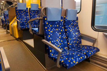 Interior of a train wagon with empty seats