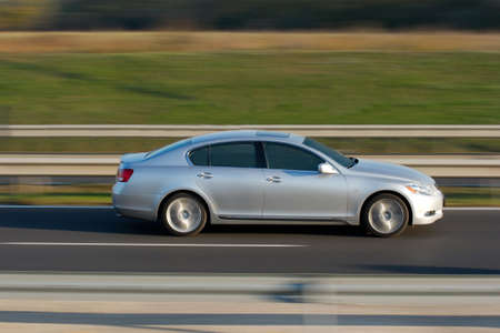 Car speeding on the highwayの写真素材