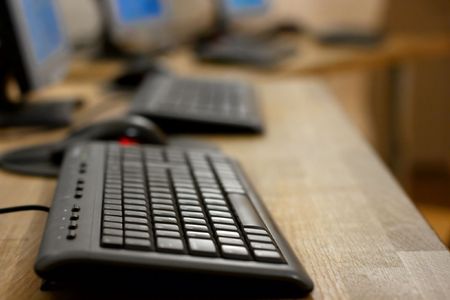Computers at an internet cafe, shallow focusの写真素材