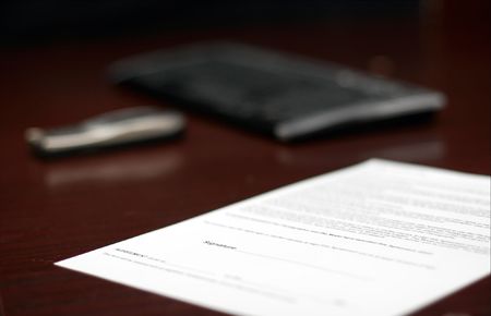 Contract on a table, shallow DoFの写真素材