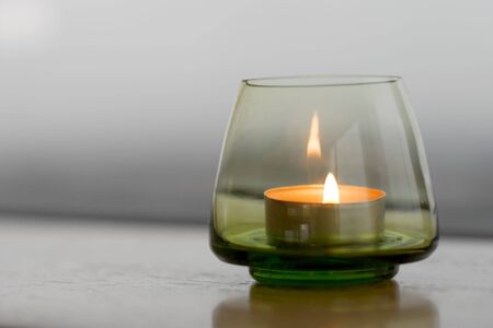 Candle in a small glass holderの写真素材