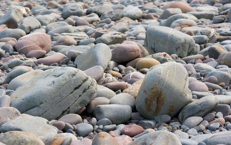 Round stones on a seashoreの写真素材