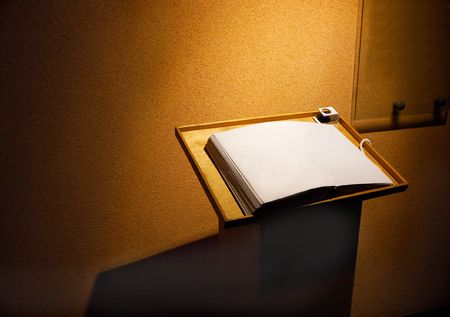 Open blank page of a book in a dim roomの写真素材