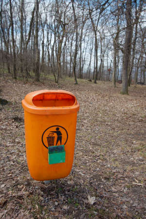 Dustbin along the path, orange colorの写真素材