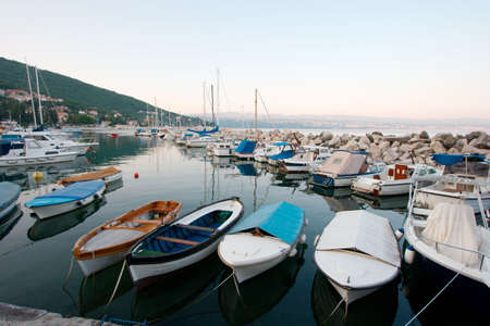Boats in the harbor of a mediterranean villageの写真素材
