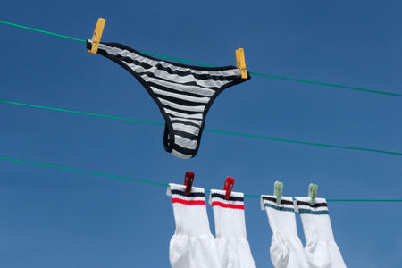Clothes drying on the rope outdoorsの写真素材