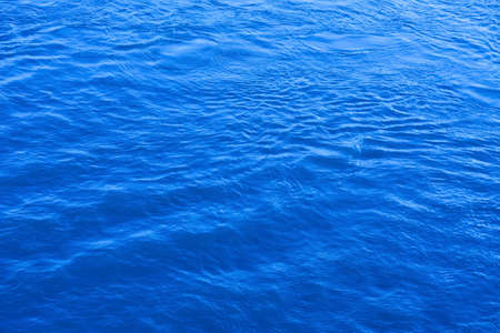 Blue, waving water surfaceの写真素材