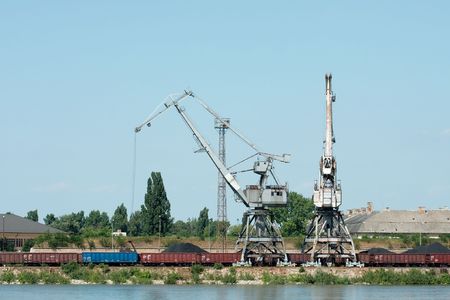 Old rusty industrial dock with freight trainの写真素材
