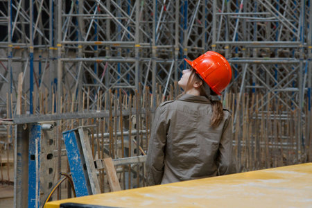 Construction site with female engineer checking things