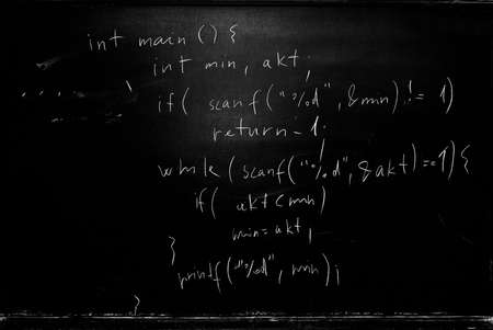 School blackboard with programming source code written on itの写真素材