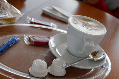 A cup of coffee on the tableの写真素材