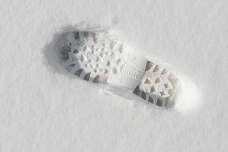 Footprint in the fresh white snowの写真素材