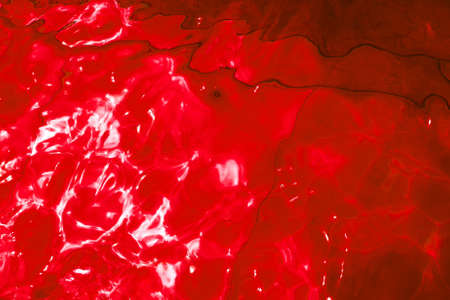 Rippling red liquid backgroundの写真素材
