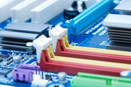 Computer mainboard closeup with lots of electronic componentsの写真素材